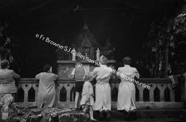 TUBERNALT PRAYING AT SHRINE